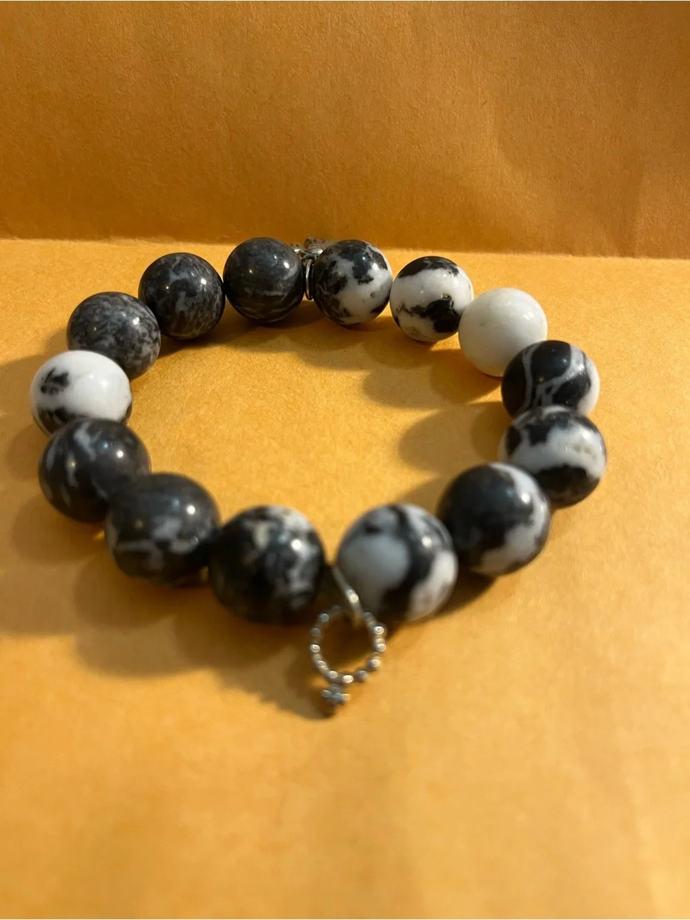 Black and White Marble Jasper Bead Bracelet with Angel Charm